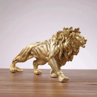 Statue doré de lion en train de marcher
