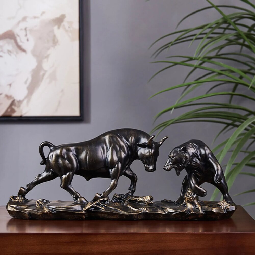 statue de taureau en train intimider un ours. Les 2 statues sont noires