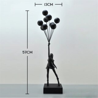 Statue art déco femme tenant ballon volant