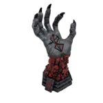On voit une statue de la main de Baphomet, une créature maléfique et satanique. L'objet est effrayant, les doigts crochus et le poignet est orné de têtes de morts agonisant.