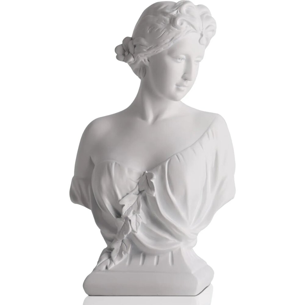 On voit la statue d'Aphrodite, un buste blanc, qui tourne la tête sur le côté et qui est légèrement vêtue.