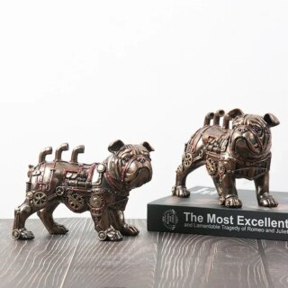 Deux statues industrielles Bouledogue en engrenages, une sur un livre et l'autre sur la table.