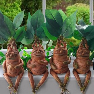 Statues Harry Potter Mandragores pour jardin disposées sur un bac à fleurs.